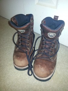 Hiking boots with black paracord laces